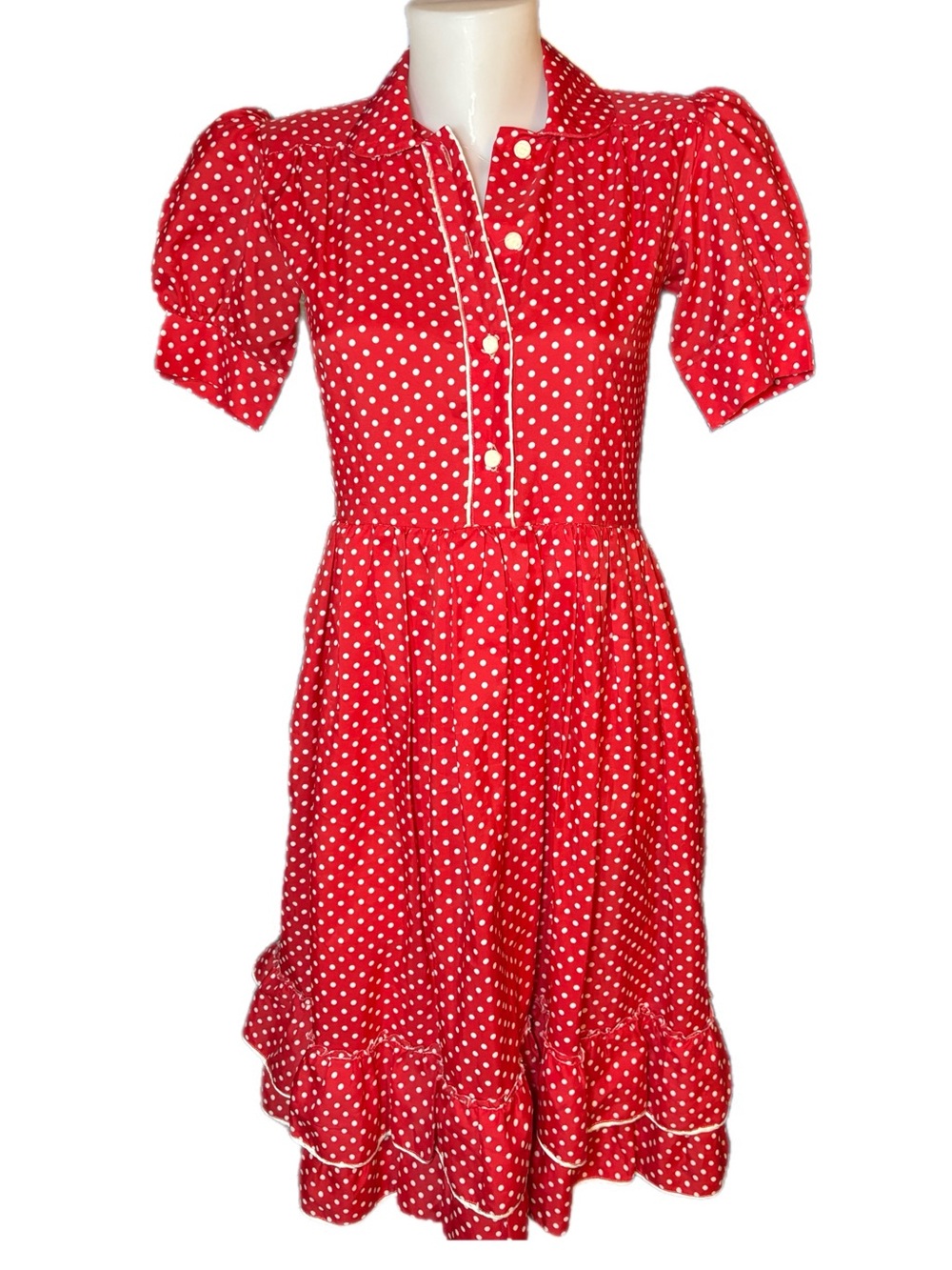 Vintage 1950s rockabilly pin-up style dress with polka dots and rose bud buttons